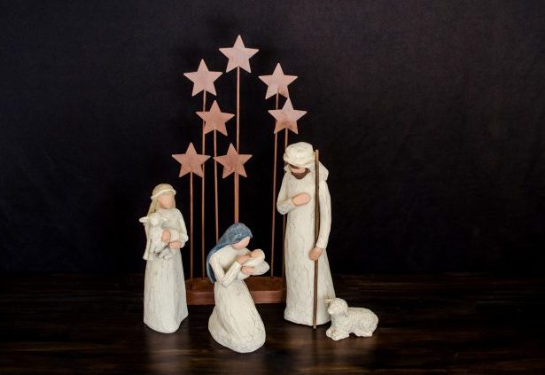 Modern nativity scene with three wooden figures